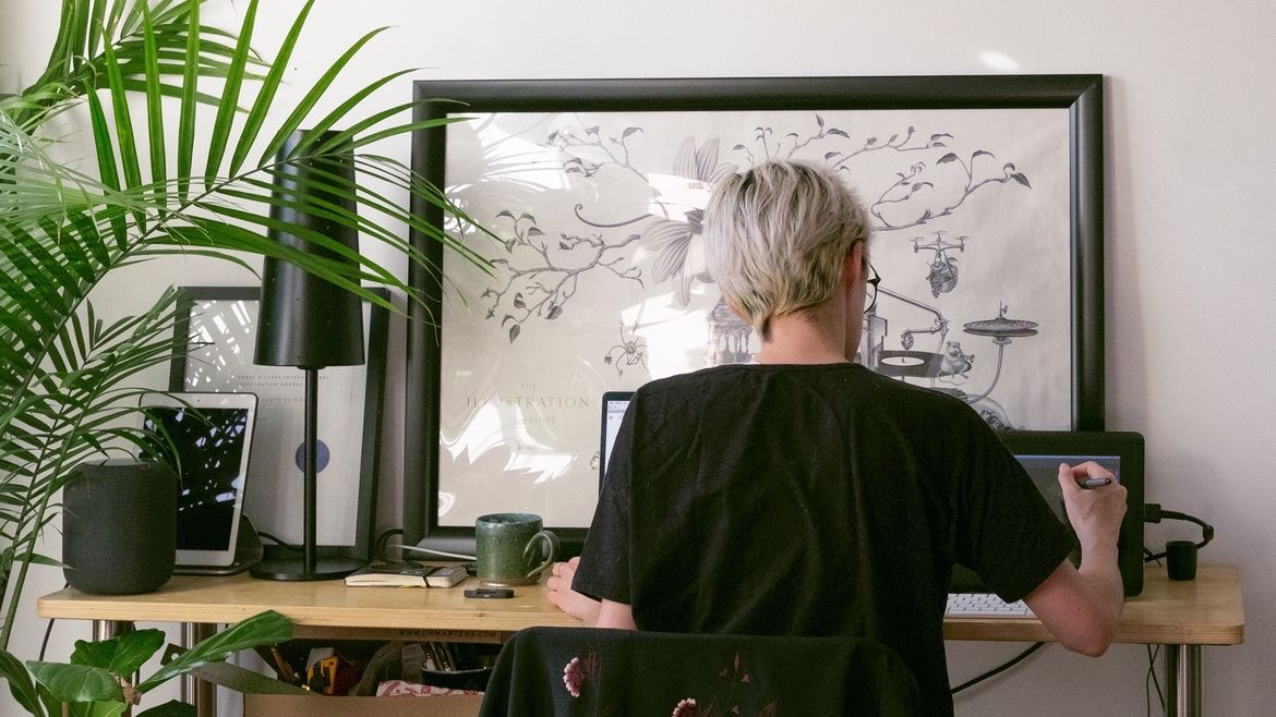 Cover Photo: Kim Salt sits at her desk at work